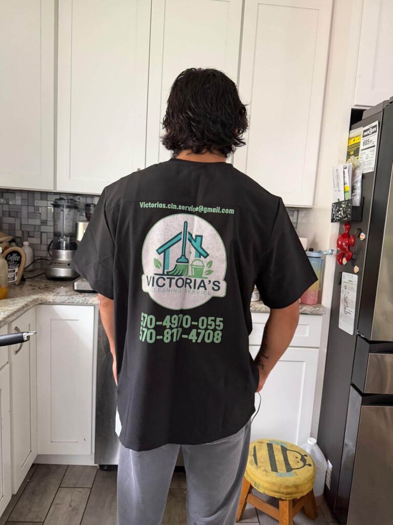 Owner's son wearing branded t-shirt